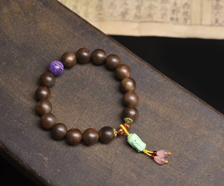 黑油软丝沉香手串 搭配紫龙晶 绿松玛瑙抽象佛 猫眼石弟子珠 尺寸11毫米的来源图片